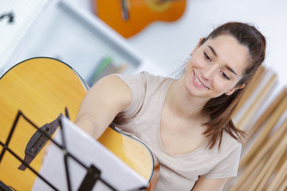 Woman playing the guitar