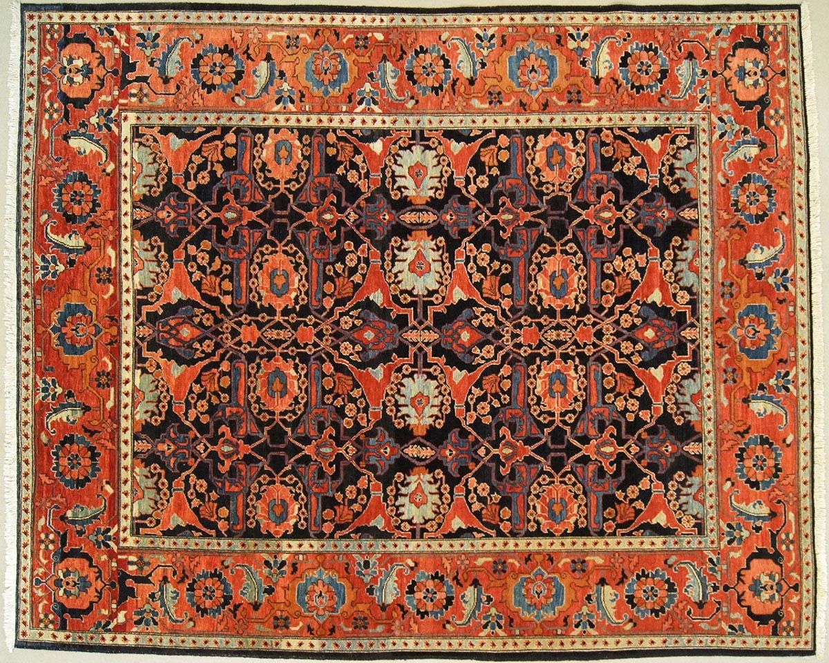 Antique rectangular rug with a dark center and red border featuring floral and geometric patterns