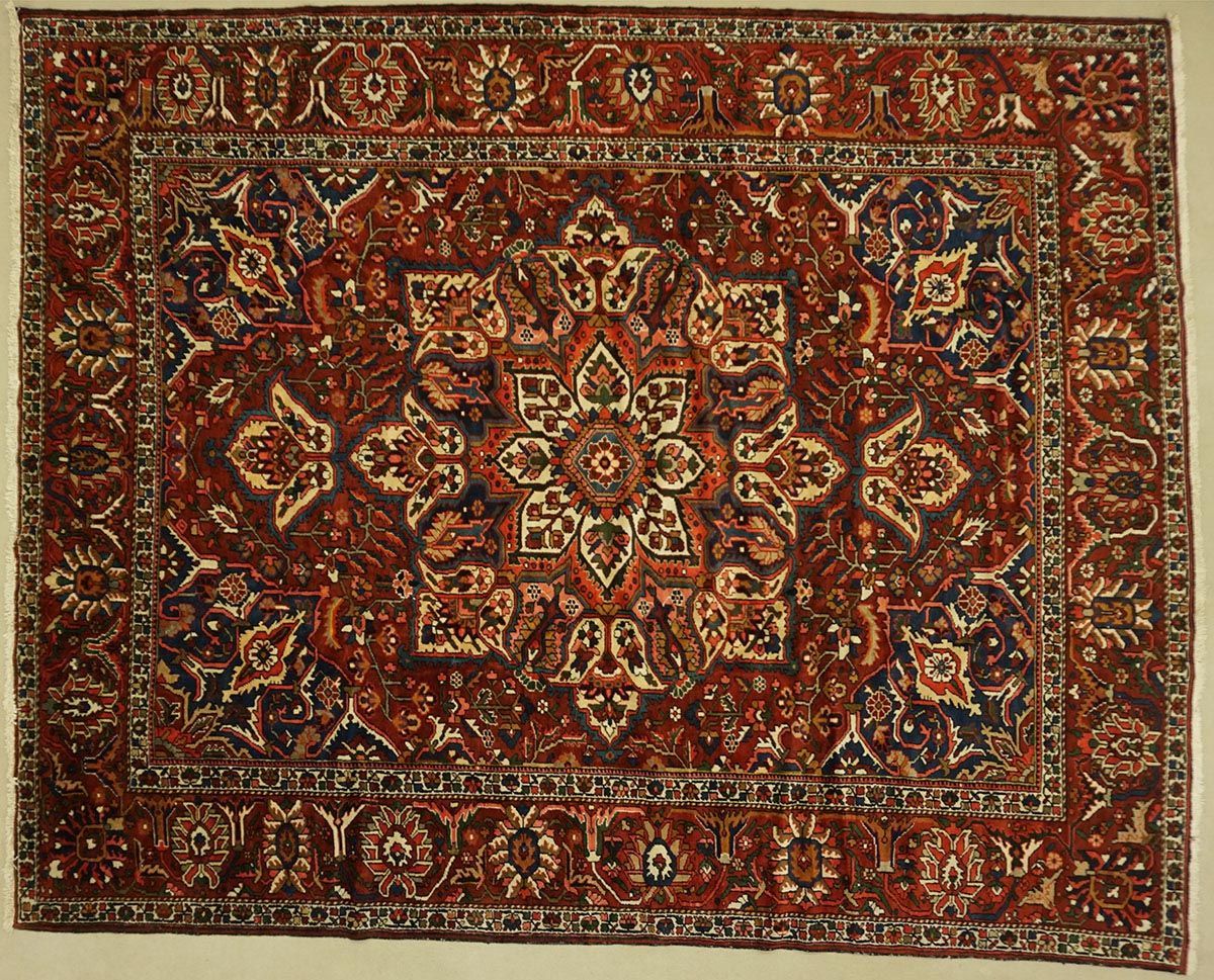 Red and blue Persian rug with floral and geometric patterns