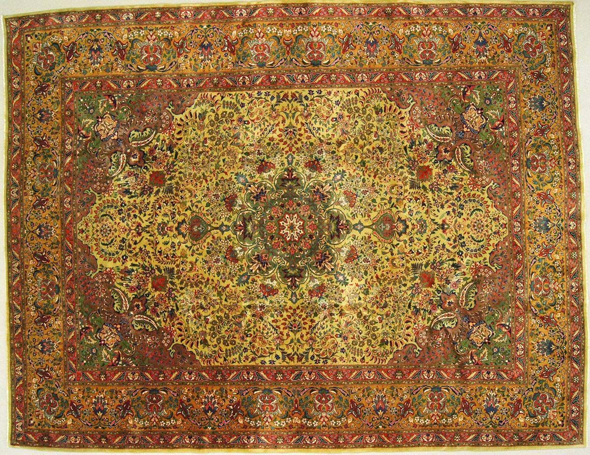 Detailed Persian rug with intricate floral patterns in yellow, red, and green