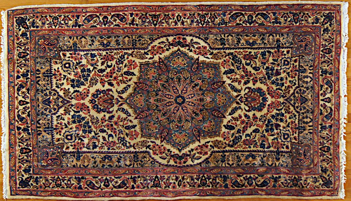 Persian rug, rectangular with floral and geometric patterns, cream, navy, and red hues