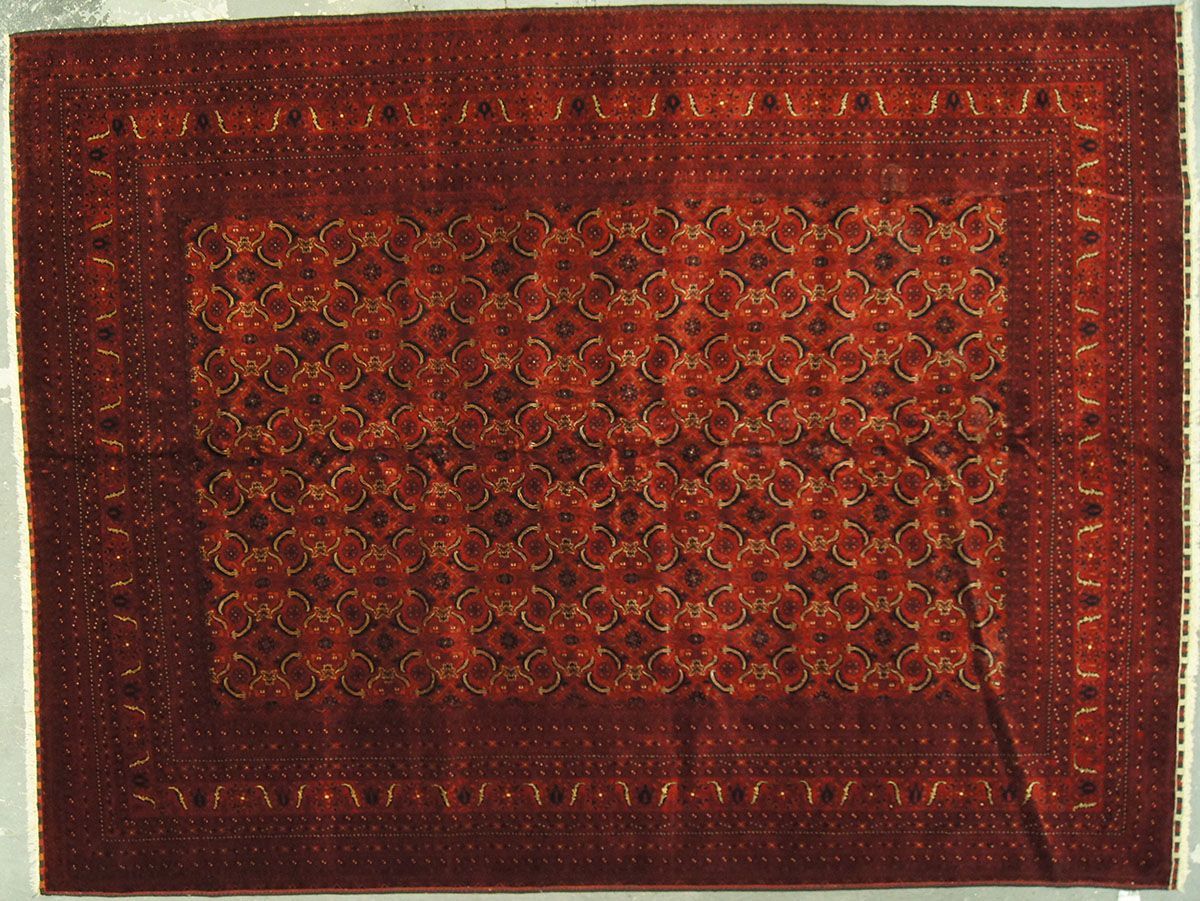 Red and gold rectangular patterned rug