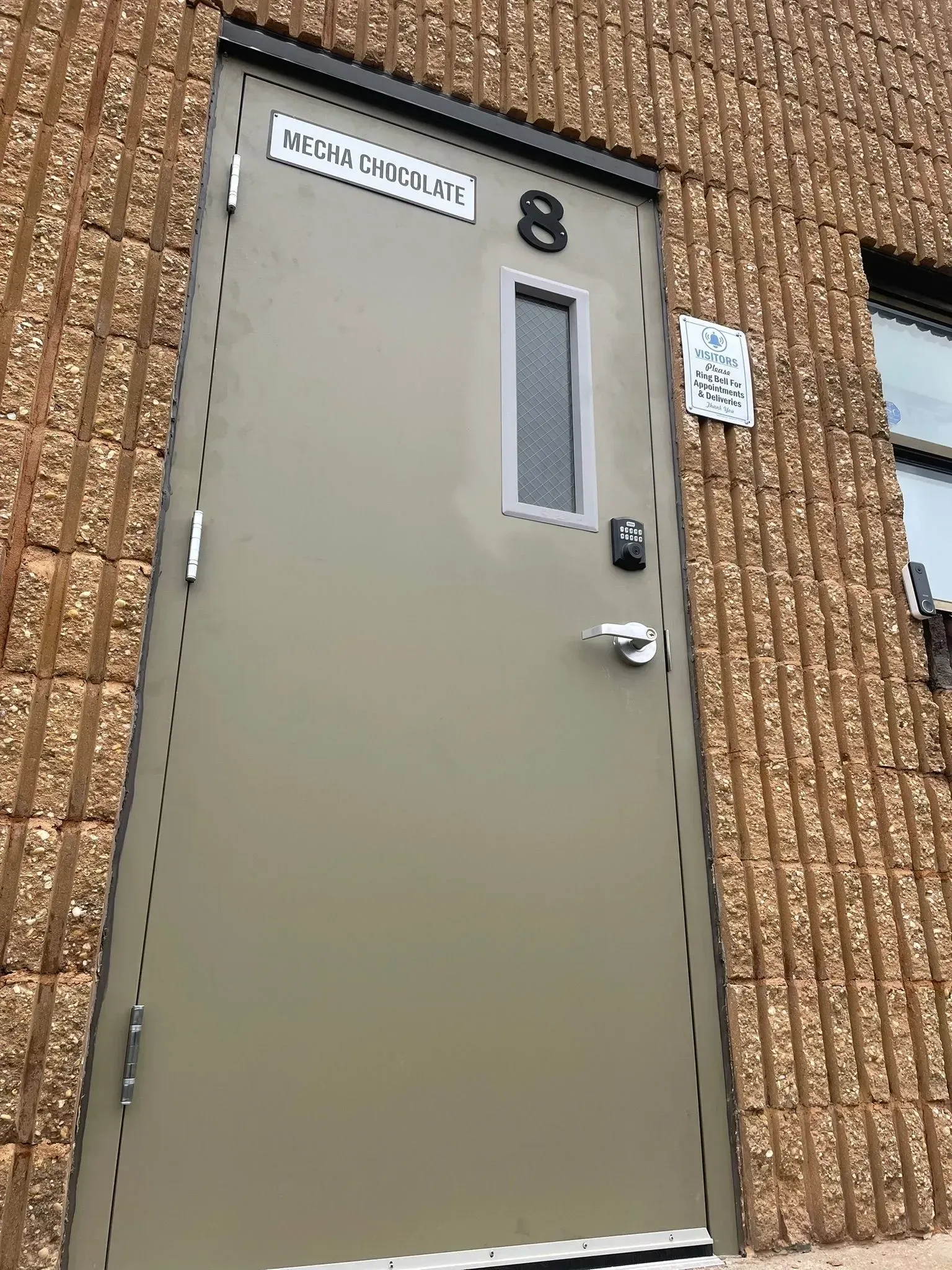 Tan door labeled 