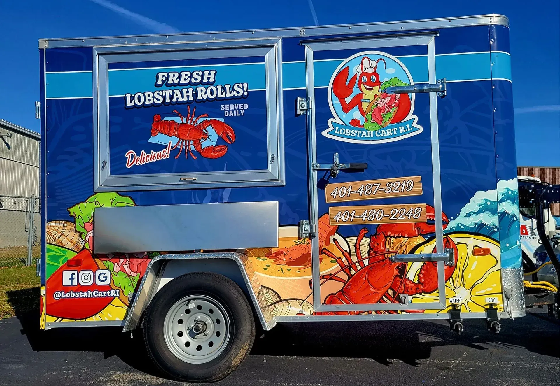 Lobster roll food truck with colorful lobster graphics against a blue background, advertising 
