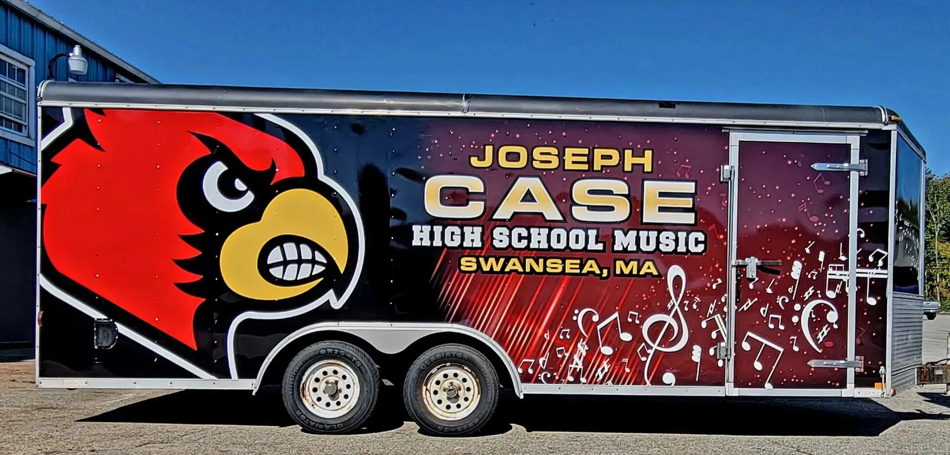 Trailer for Joseph Case High School Music in Swansea, MA, with a cardinal mascot and music notes.