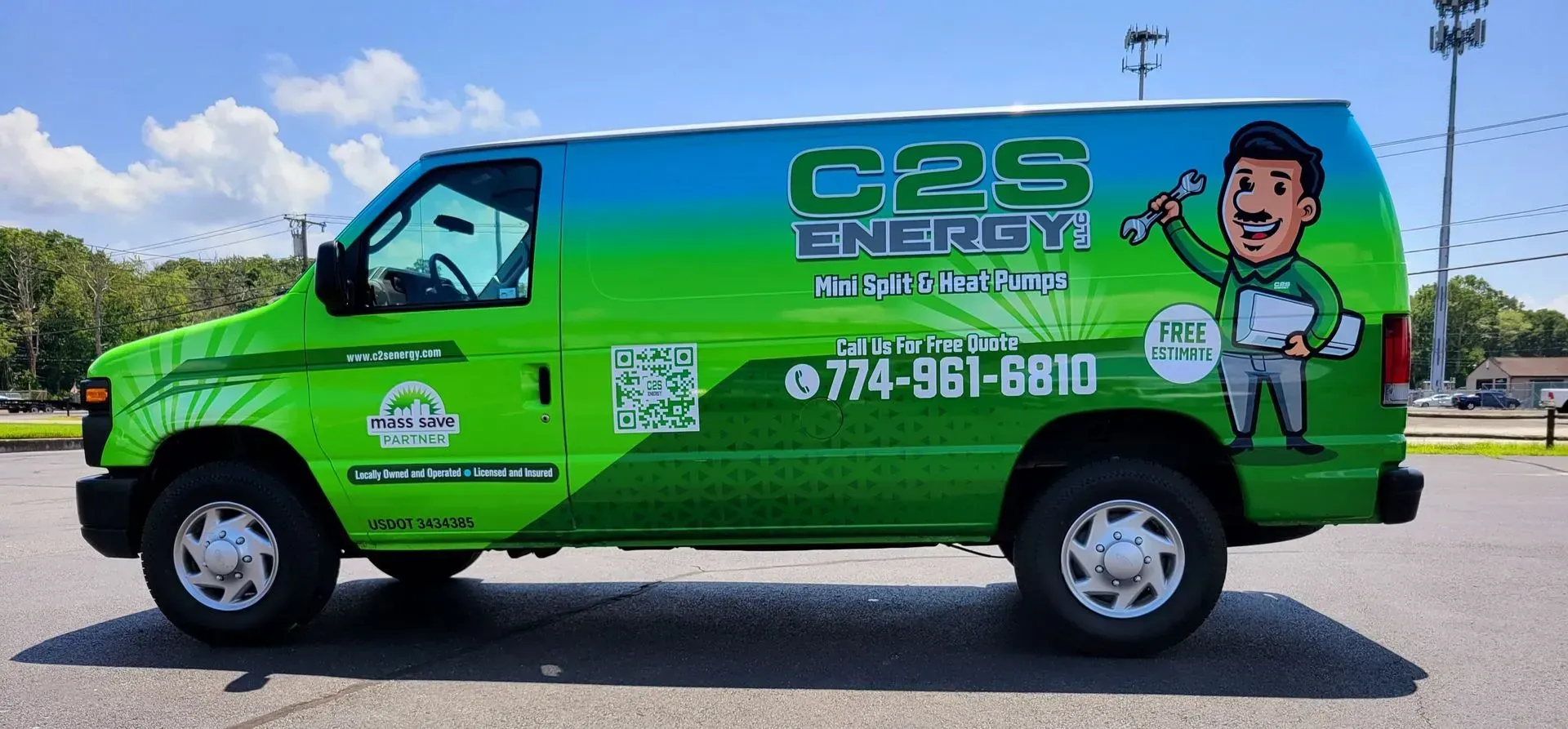 Green and blue C2S Energy van with a cartoon worker on the side.