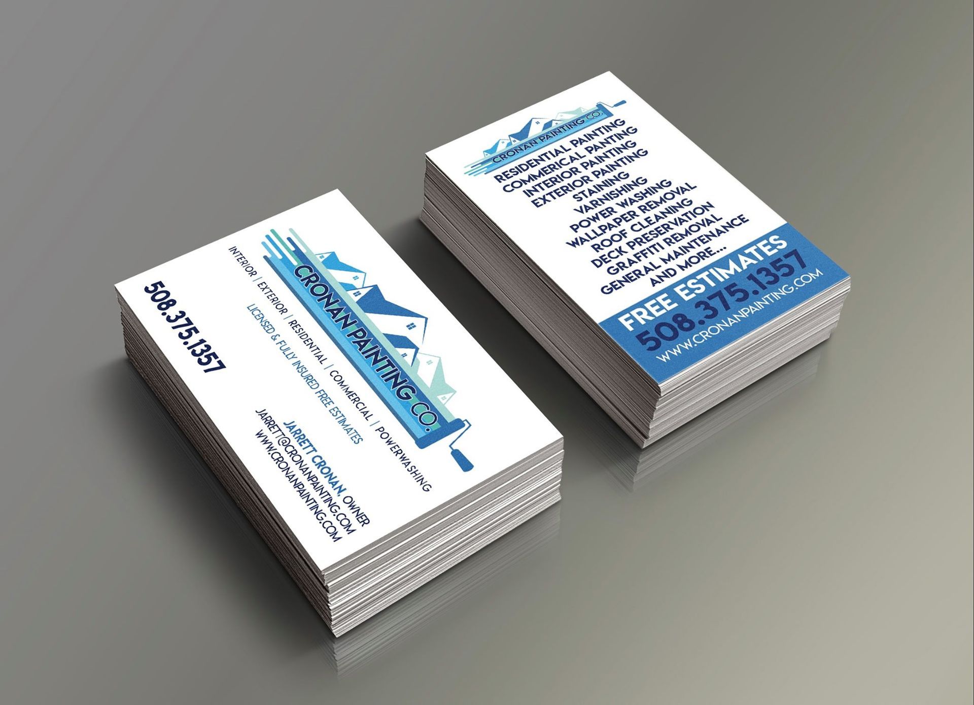 Business cards stacked, white with blue text. Painter company logo, contact info, services offered.