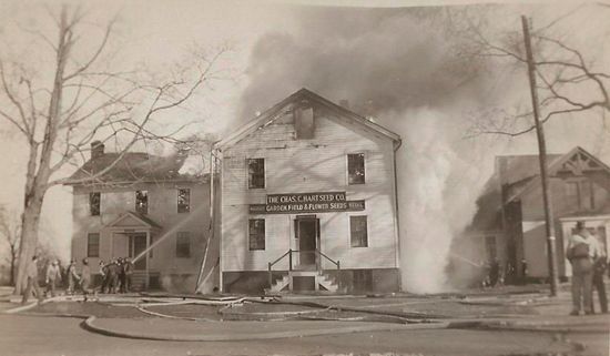 A black and white photo of a fire in a house.