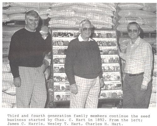 A black and white photo of three men with the caption third and fourth generation family members