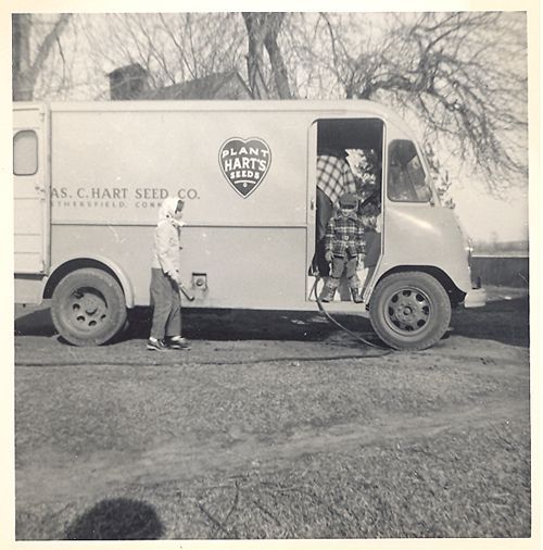 A black and white photo of a hart seed co. truck