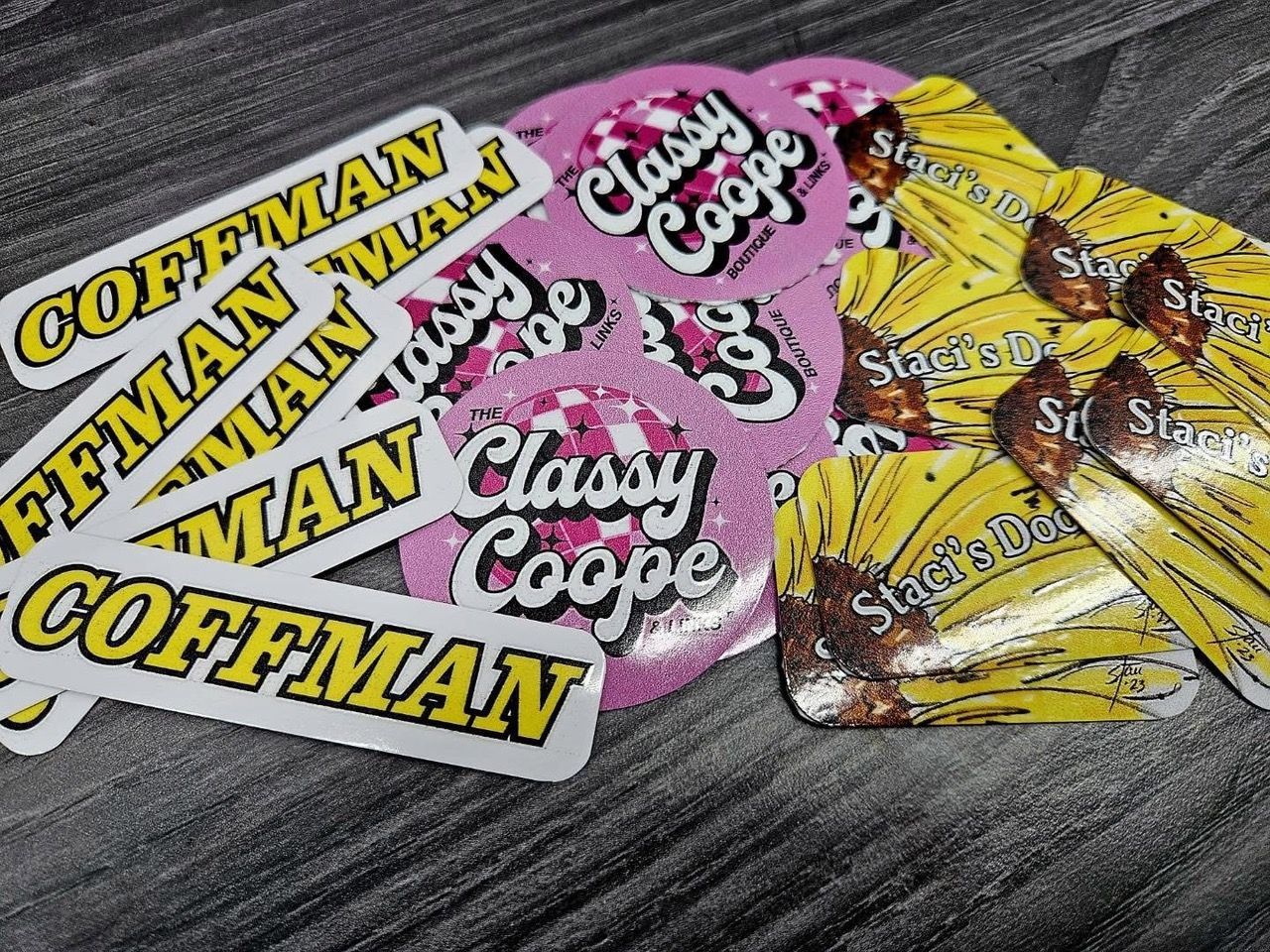 Sticker pile: 'Coffman' in yellow/white, 'Classy Coope' in pink/white, and sunflower-themed ones.
