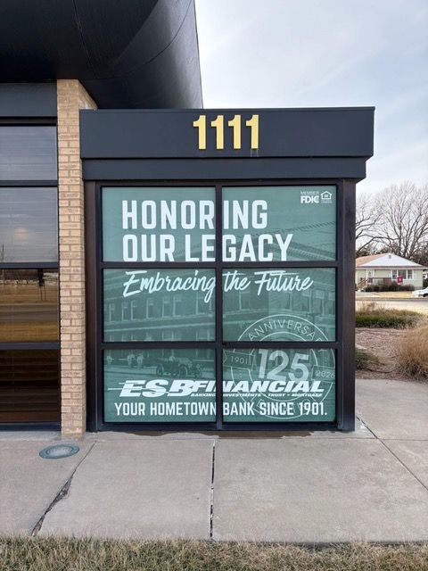 Sign on a building with the address 1111. Text reads, Honoring Our Legacy and ESB Financial, Your Hometown Bank Since 1901.