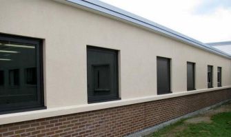 A row of windows on the side of a building.