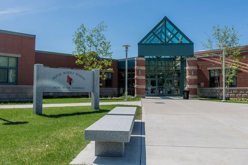 A brick building with a sign that says ' west point school ' on it