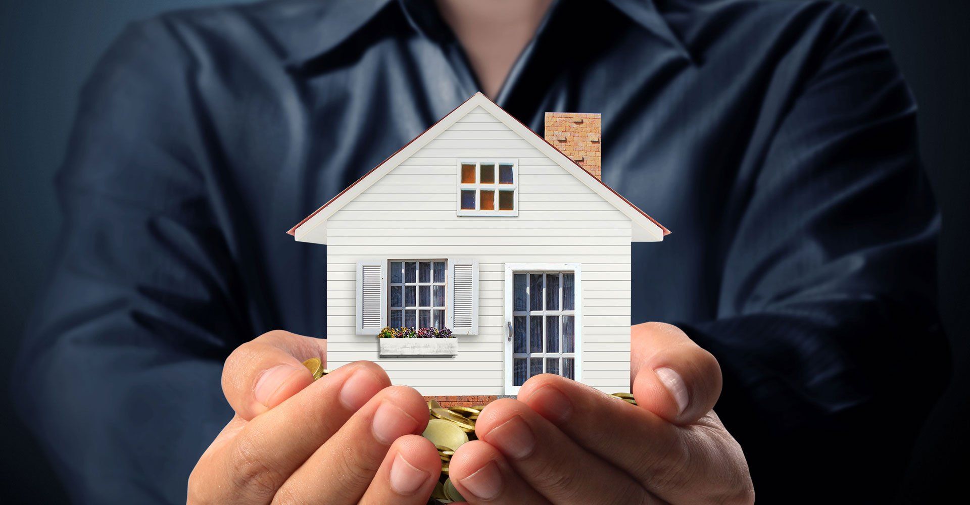 Holding house representing home ownership