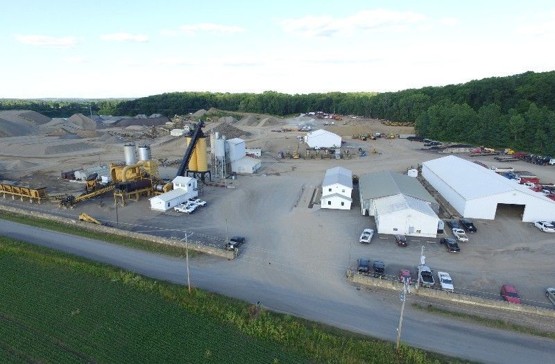 An aerial view of a construction site with a lot of buildings and machinery.