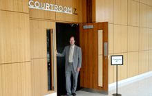 Man standing outside the courtroom