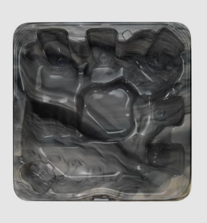 Gray and marbled hot tub interior with contoured seating.