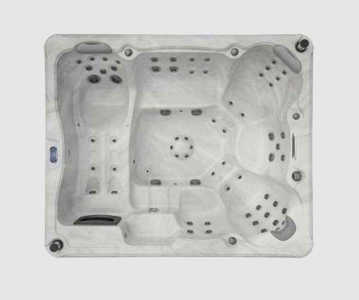Overhead view of a rectangular gray hot tub with multiple seating areas and jets.
