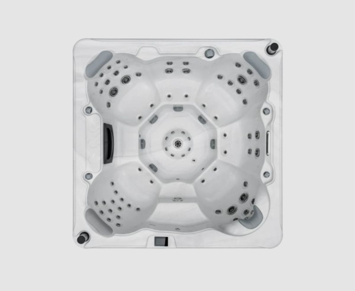 Overhead view of a white, square hot tub with multiple contoured seating areas, many jets, and a central circular feature.