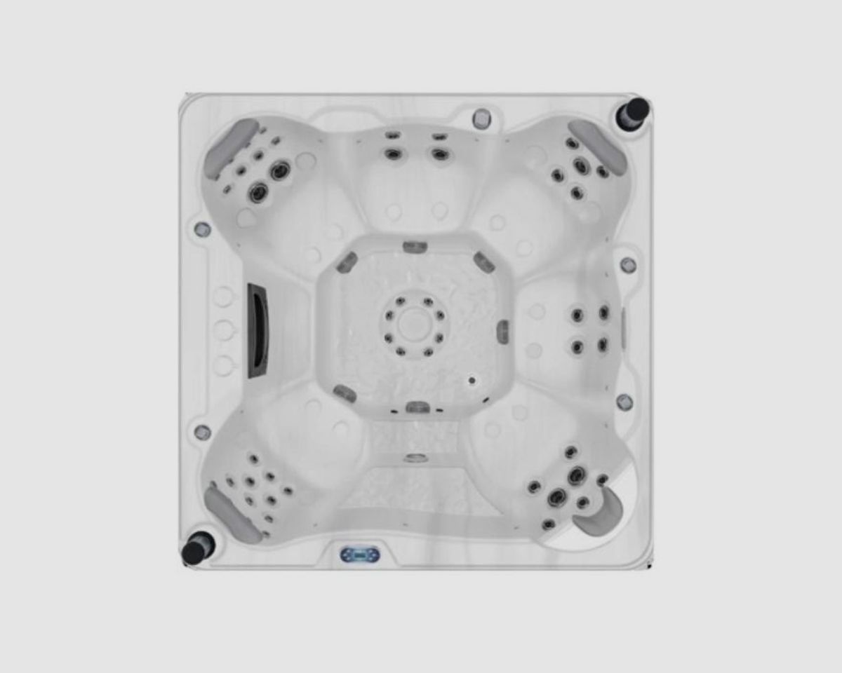 Overhead view of a square, light-colored hot tub with multiple jet seats and a central seating area.