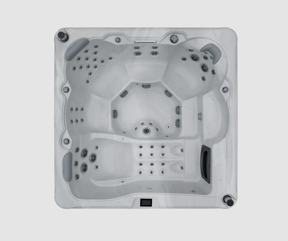 Overhead view of a square, light gray hot tub with multiple seating areas and jets.