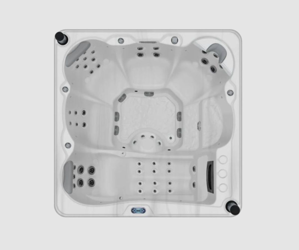 Top-down view of a white, square hot tub with multiple jet nozzles and seating areas.