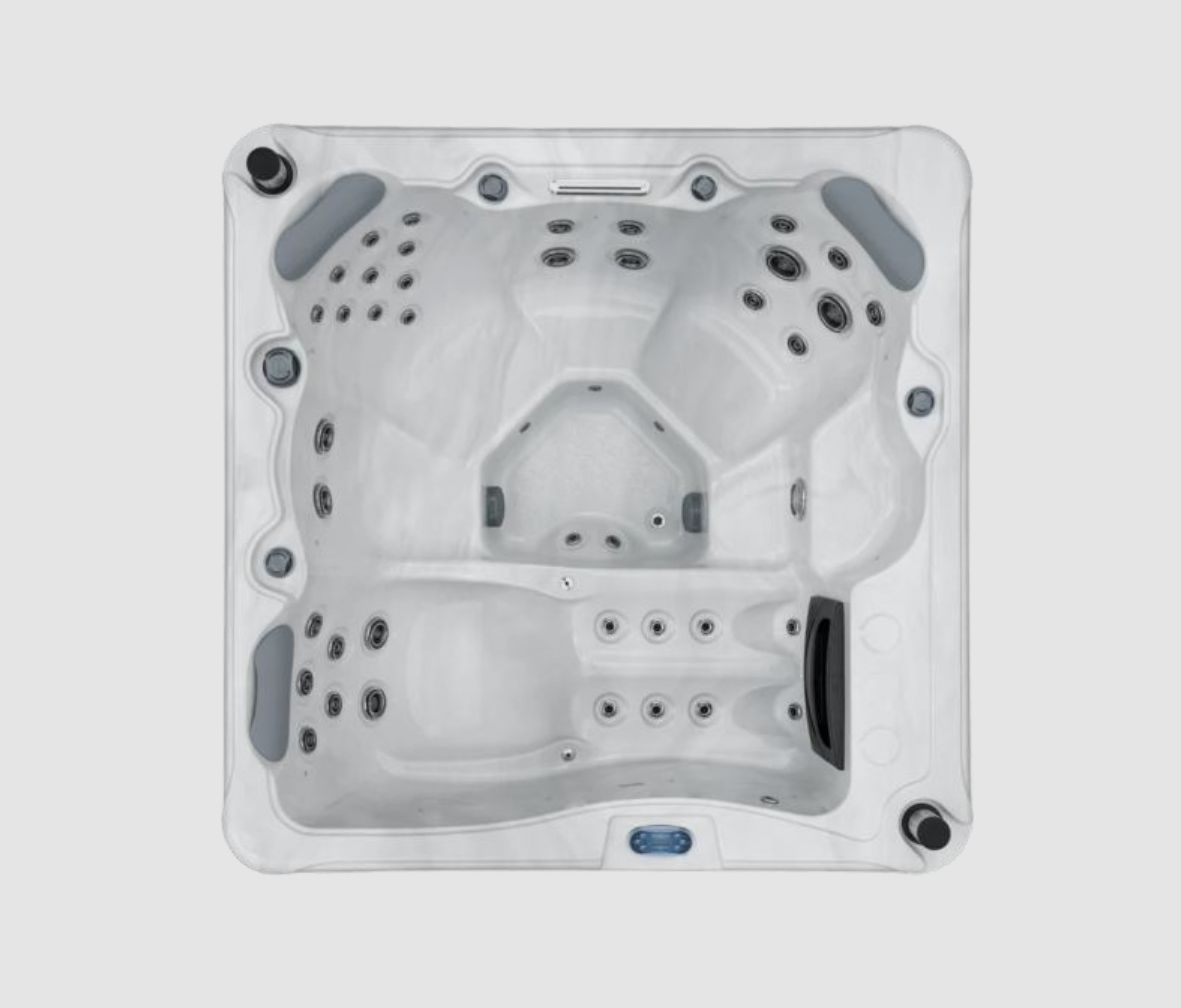 Overhead view of a white, square hot tub with multiple jet seats and gray headrests.