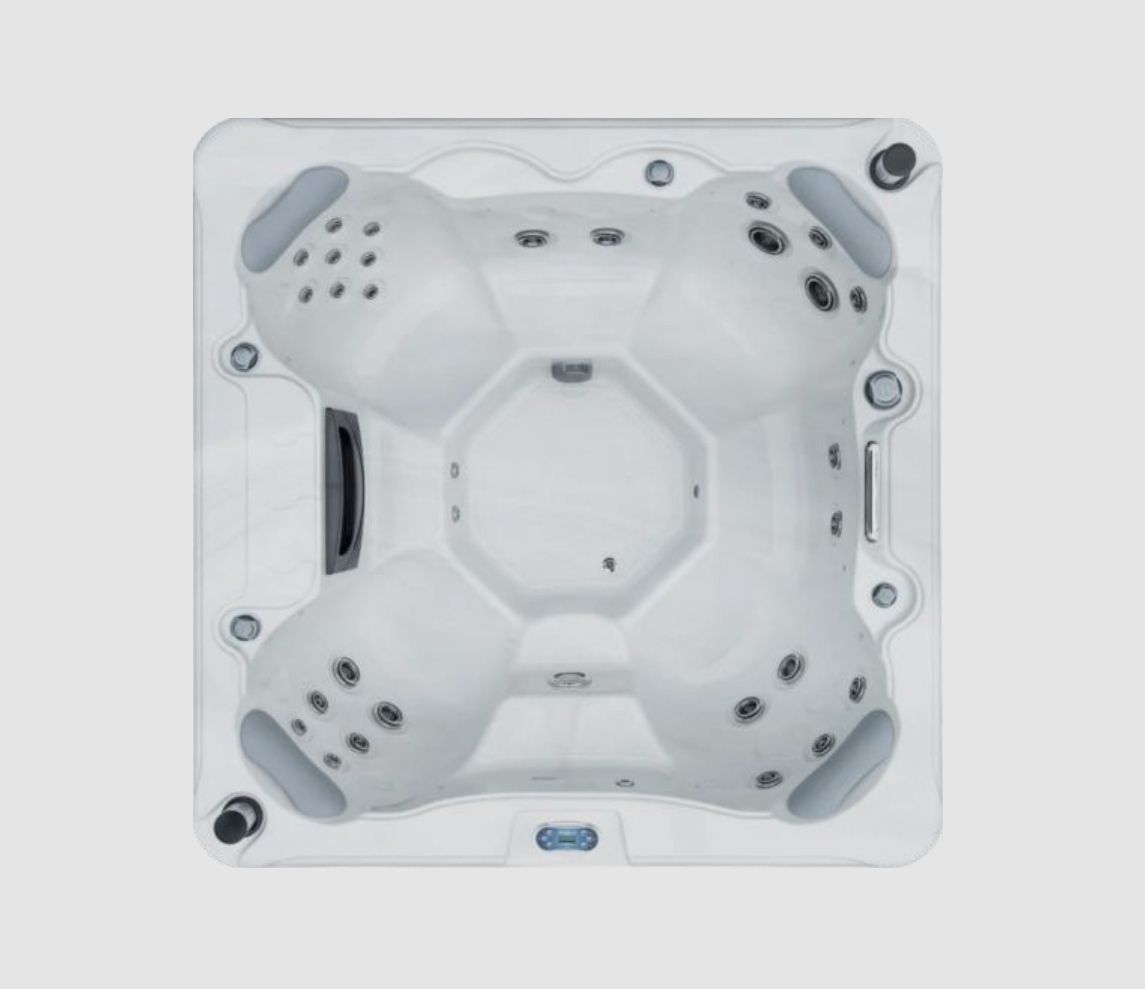 Overhead view of a square, white hot tub with gray accents and multiple jet nozzles.