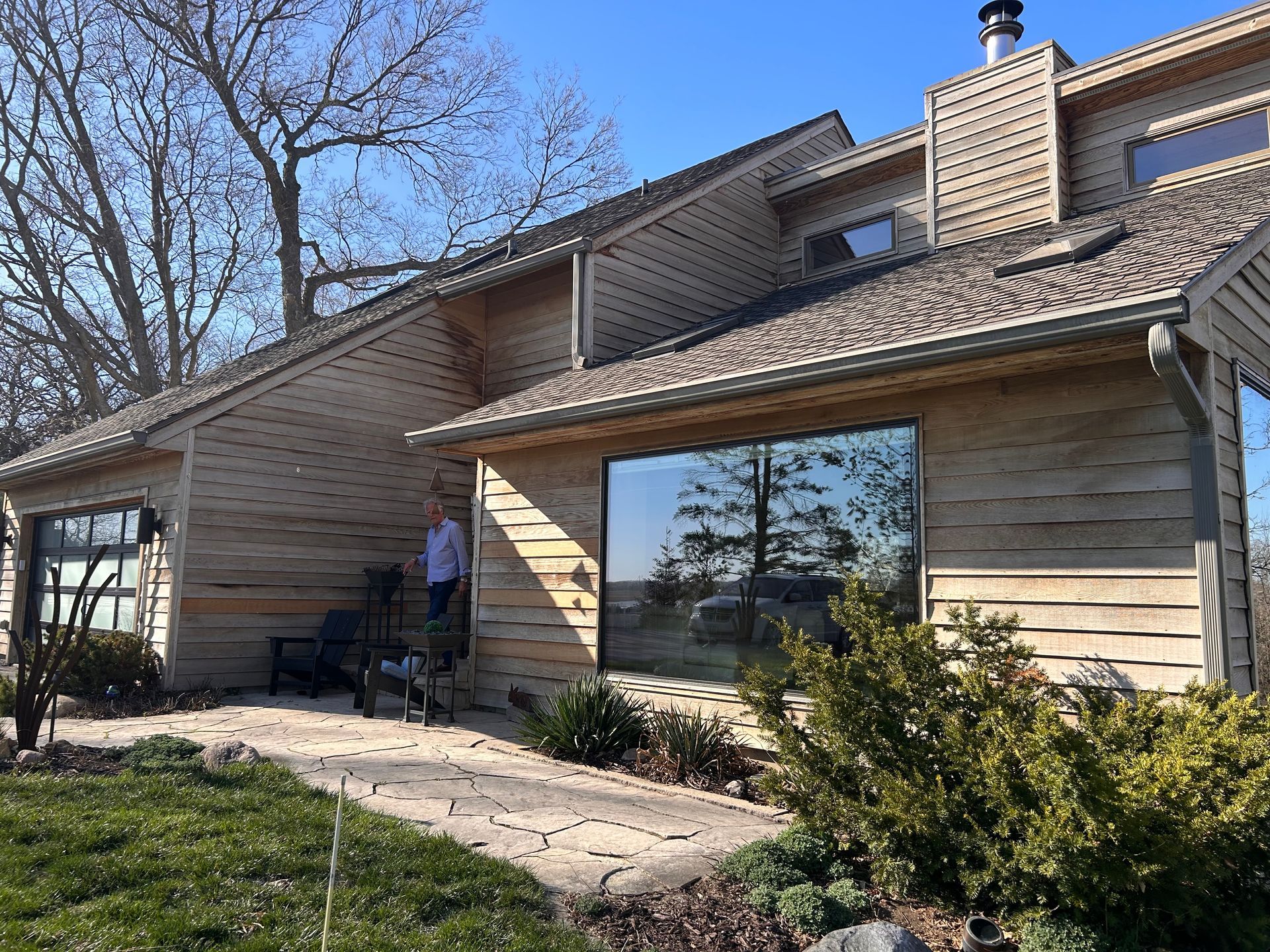 Brown house with guy on steps