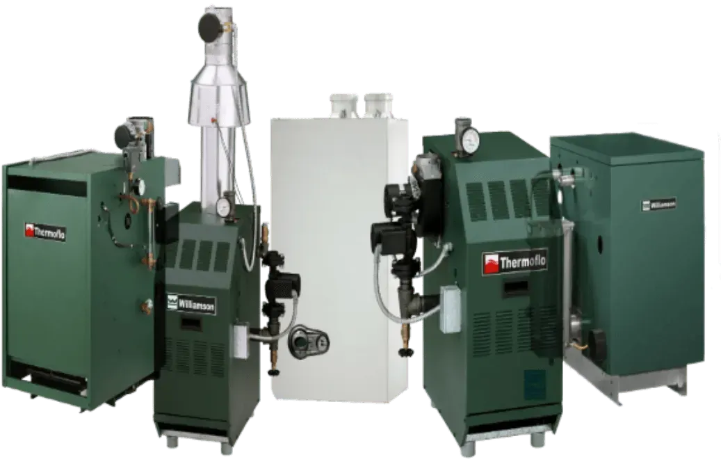 Several dark green Burnham boilers with white venting and tanks, side by side.