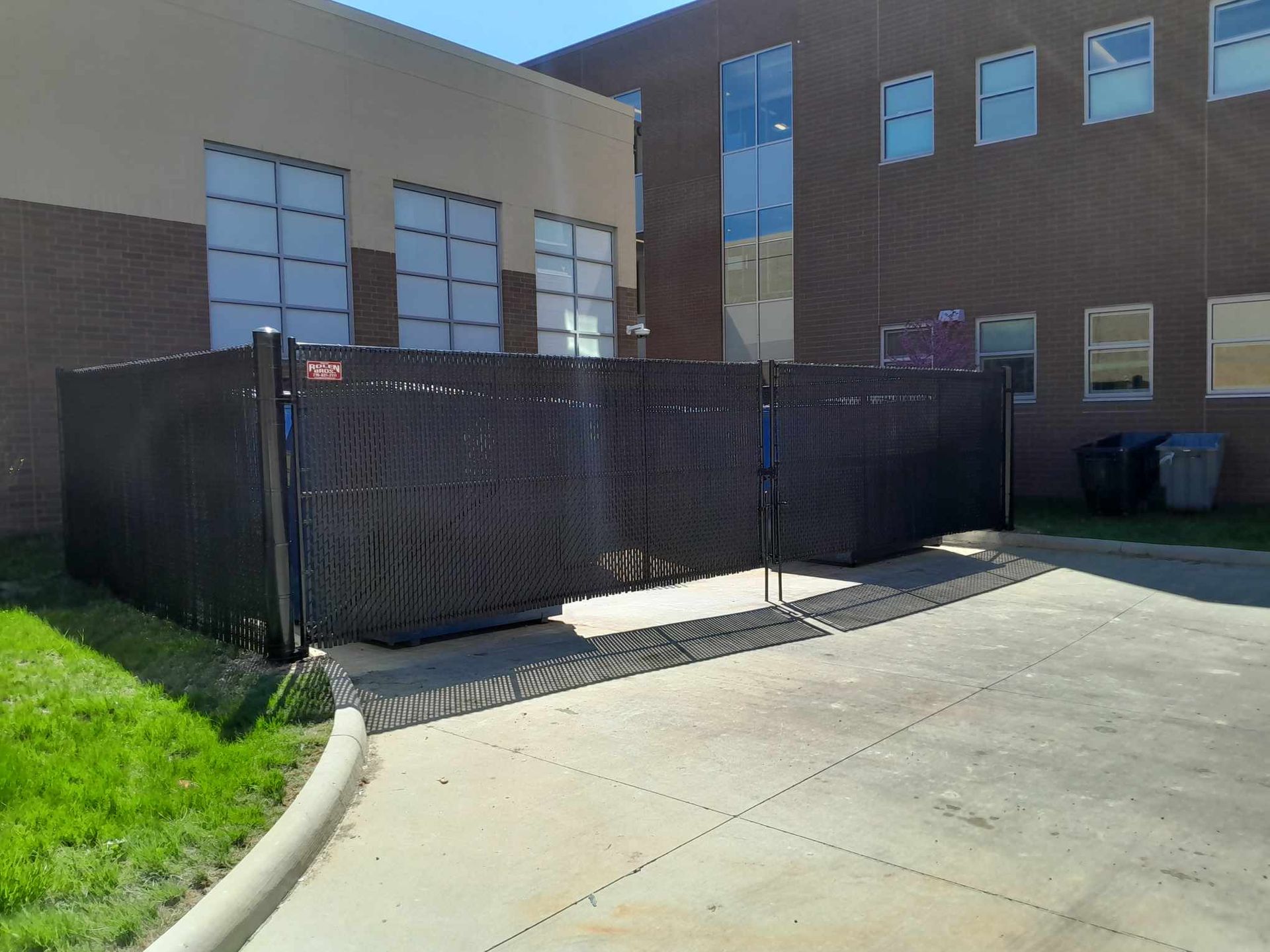 A large building with a fence in front of it