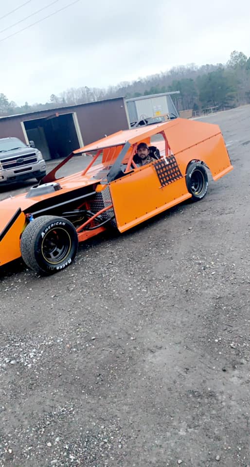 Man riding a race car