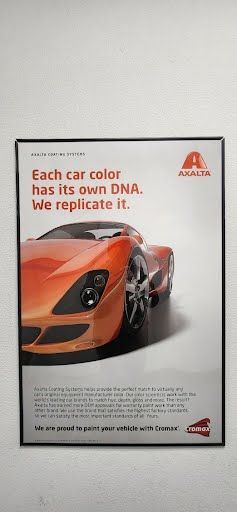 Poster with an orange car and text: 
