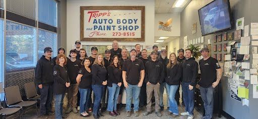 Group of people posing in front of 