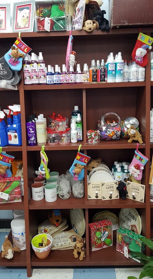 A shelf filled with a variety of items including bottles and toys.