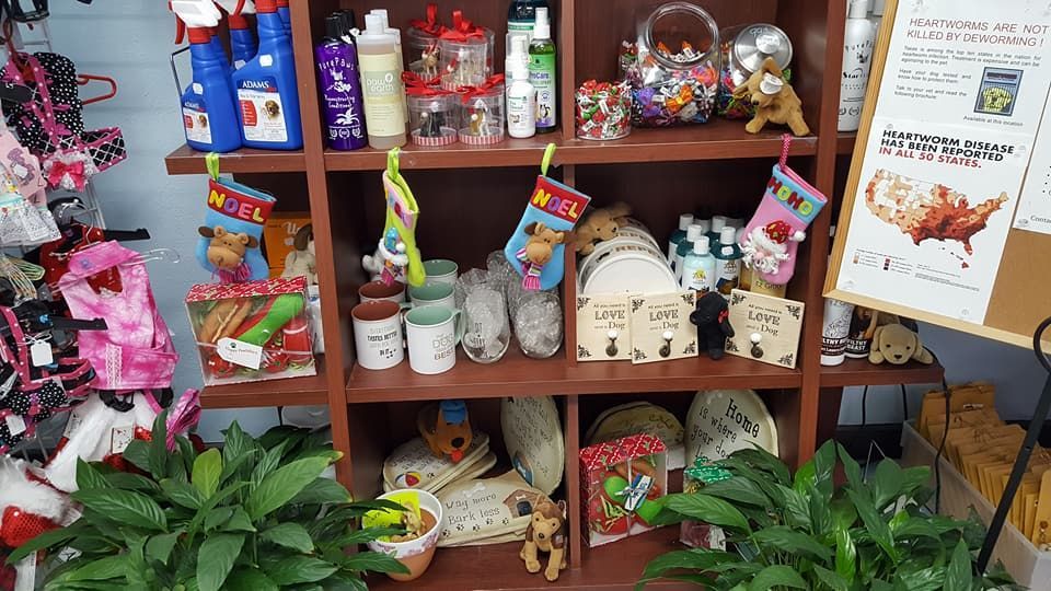 A shelf filled with lots of christmas decorations and plants.