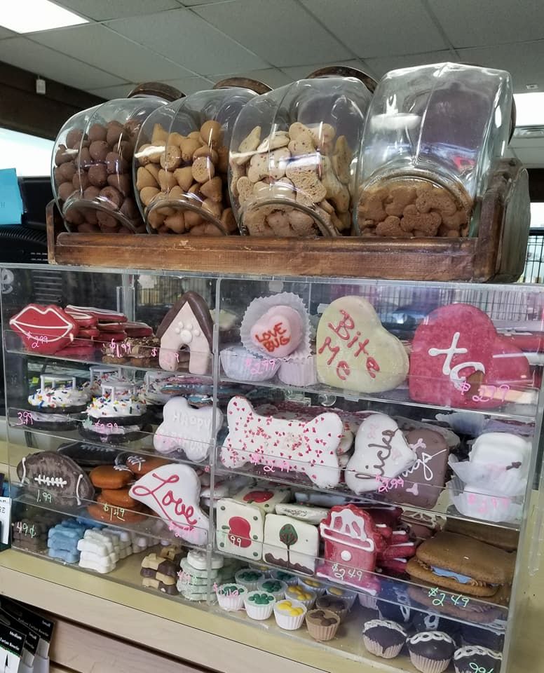 A display case filled with lots of dog treats and toys.