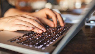 Learn More About New Patient Forms Using laptop