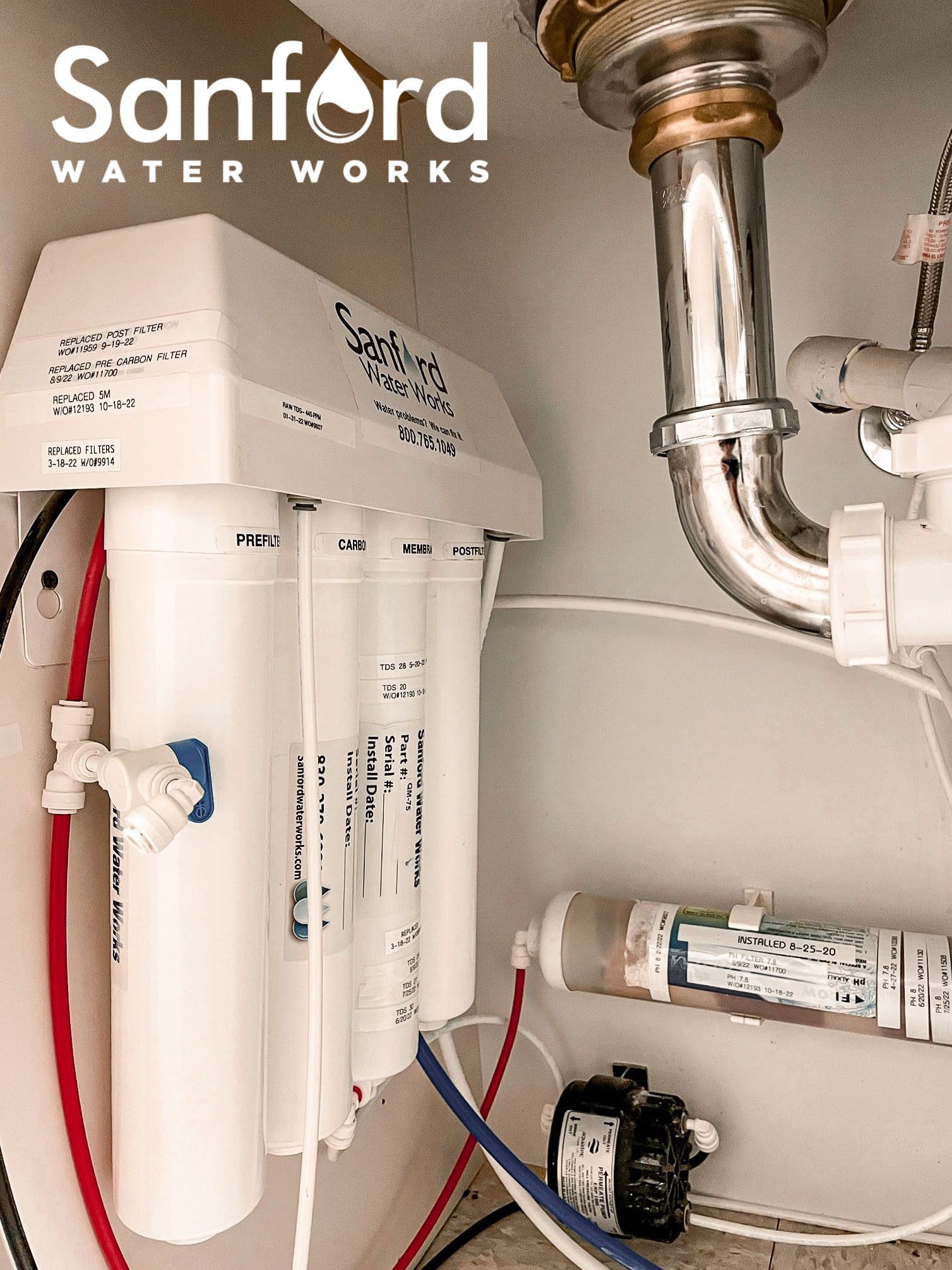 A drinking water filter is installed under a sink