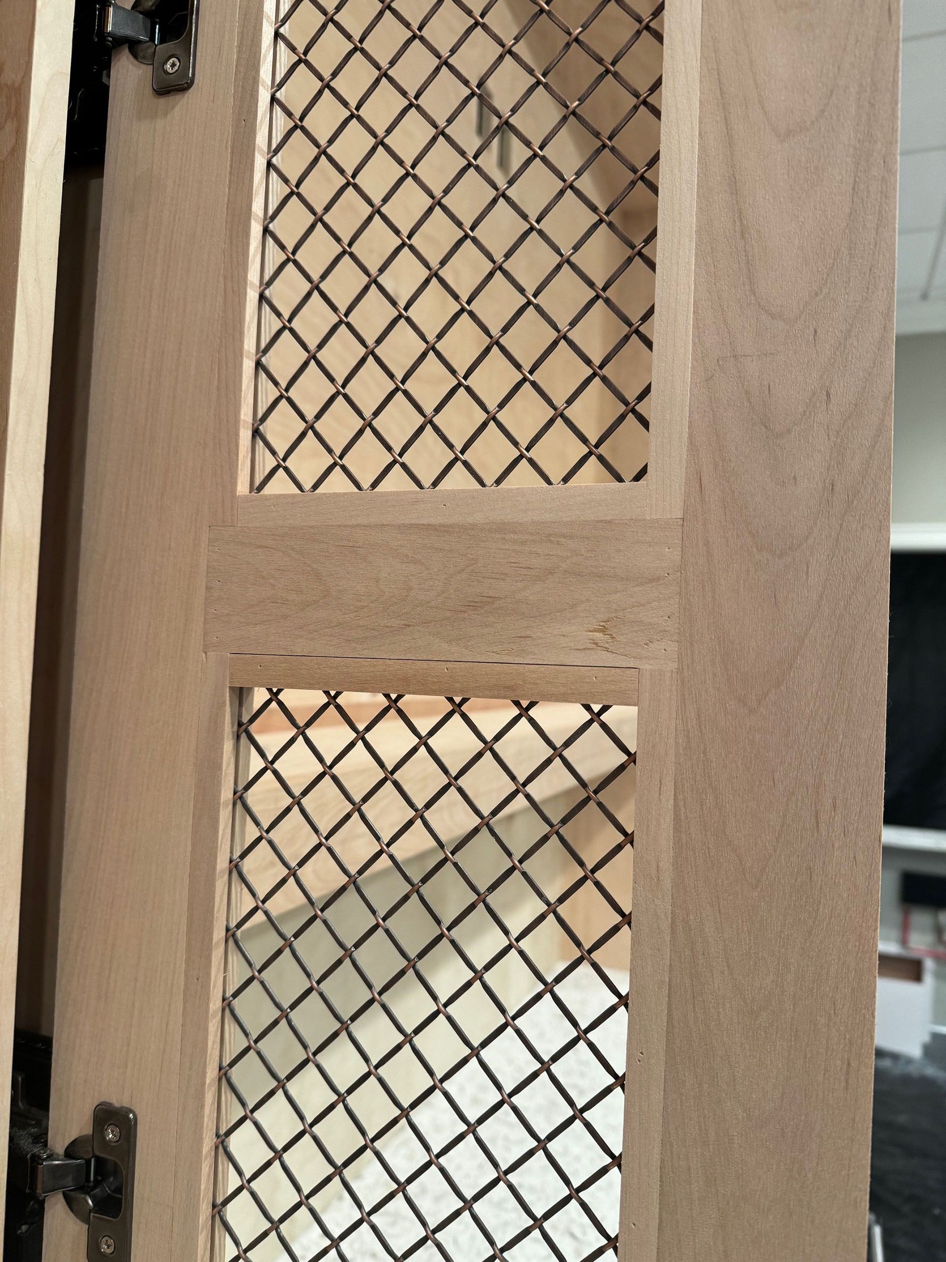 Miscellaneous Kitchen Projects - Wooden cabinet door with diamond-patterned metal mesh inserts. Hinges on left.