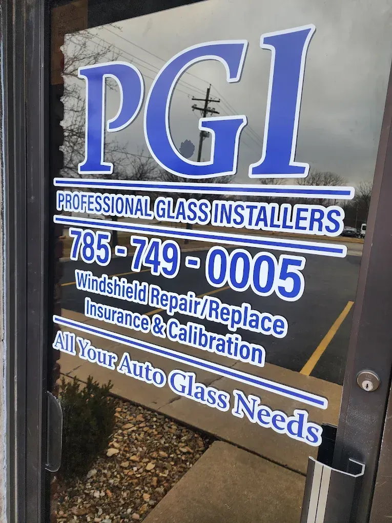 PGI professional glass installers sign with phone number and auto glass repair services