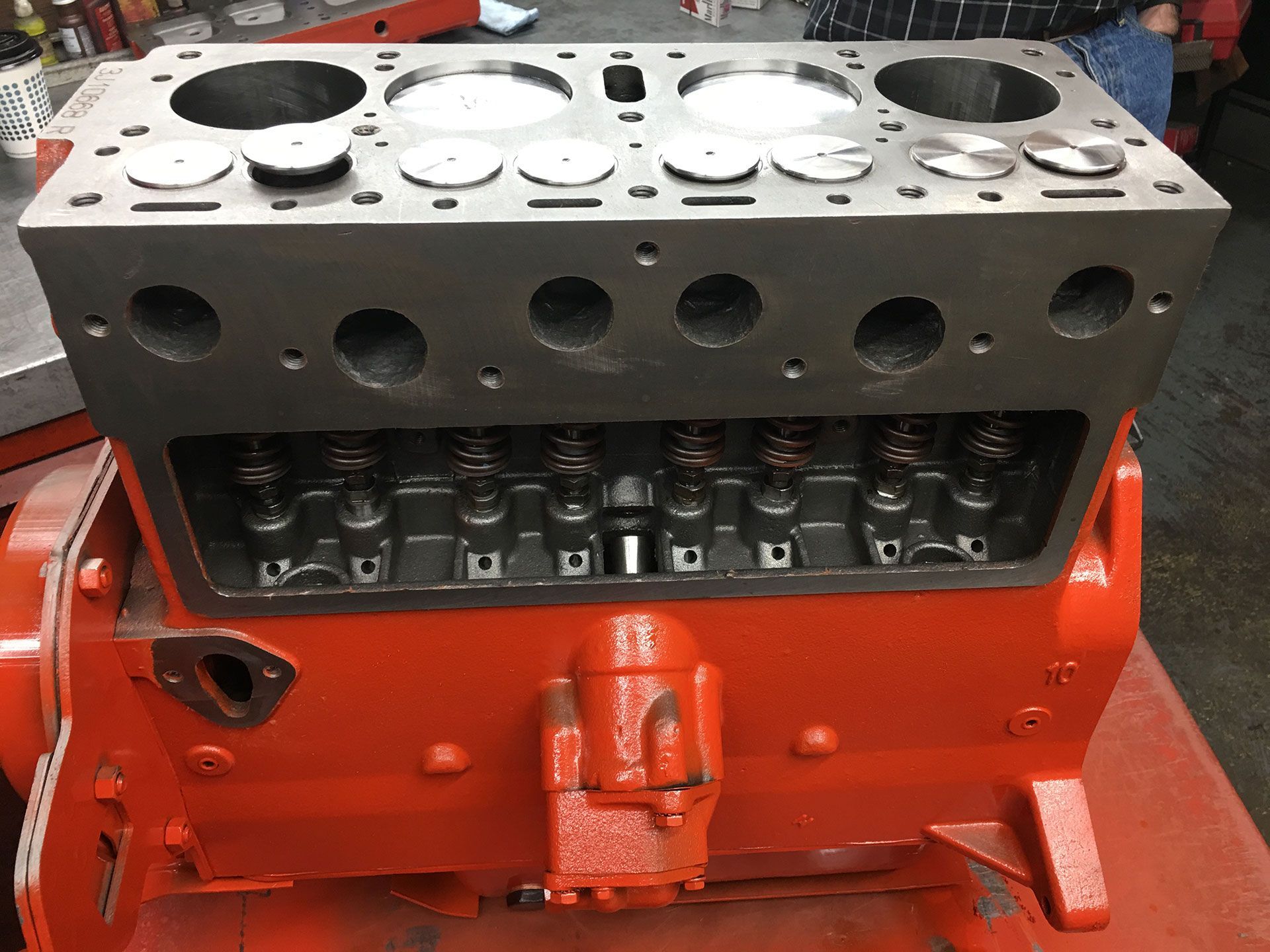 A red engine block on top of a table
