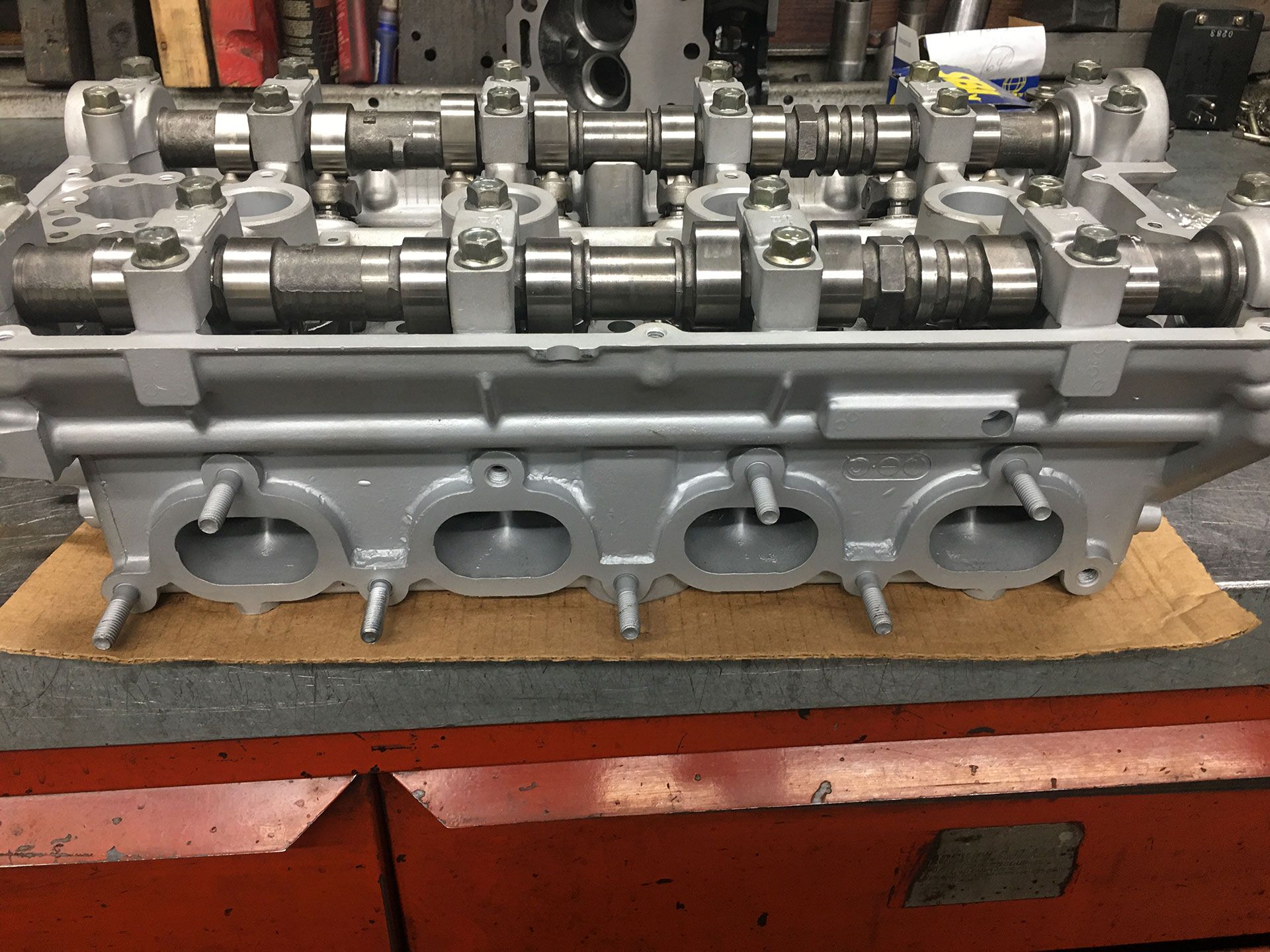 A close up of a cylinder head on a table