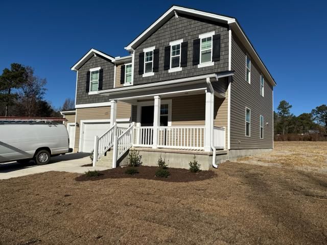 A house with a lot of windows and a shingle roof.