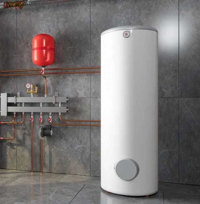 A white water heater is sitting in a room next to a wall.