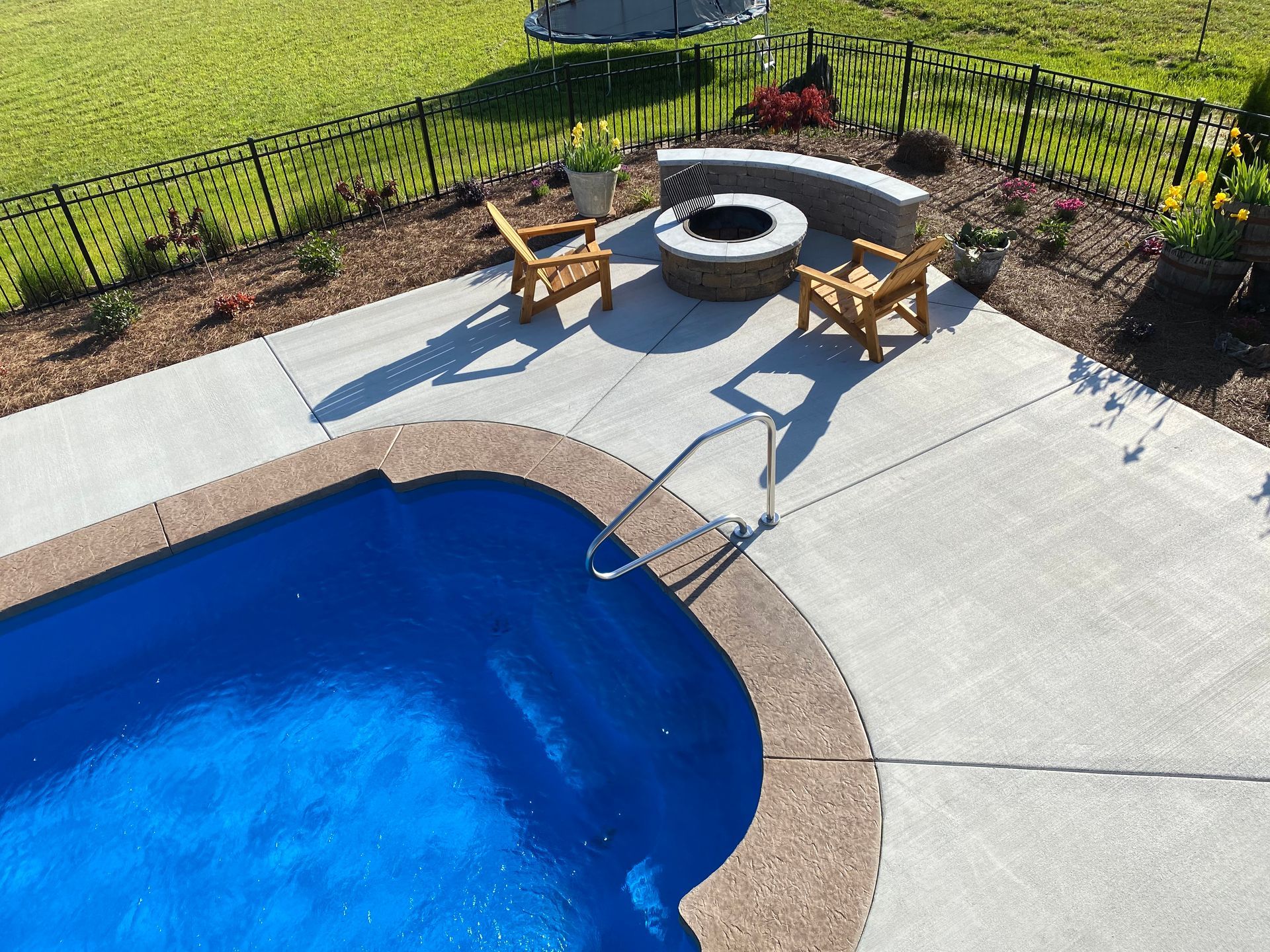 There is a fire pit in the middle of the pool.