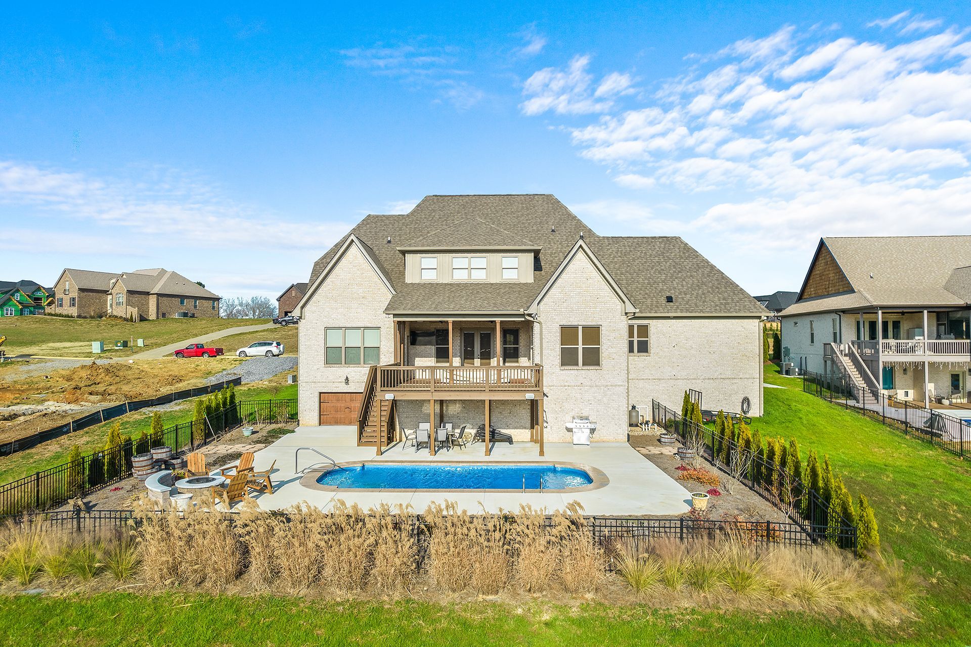 A large house with a large swimming pool in the backyard.
