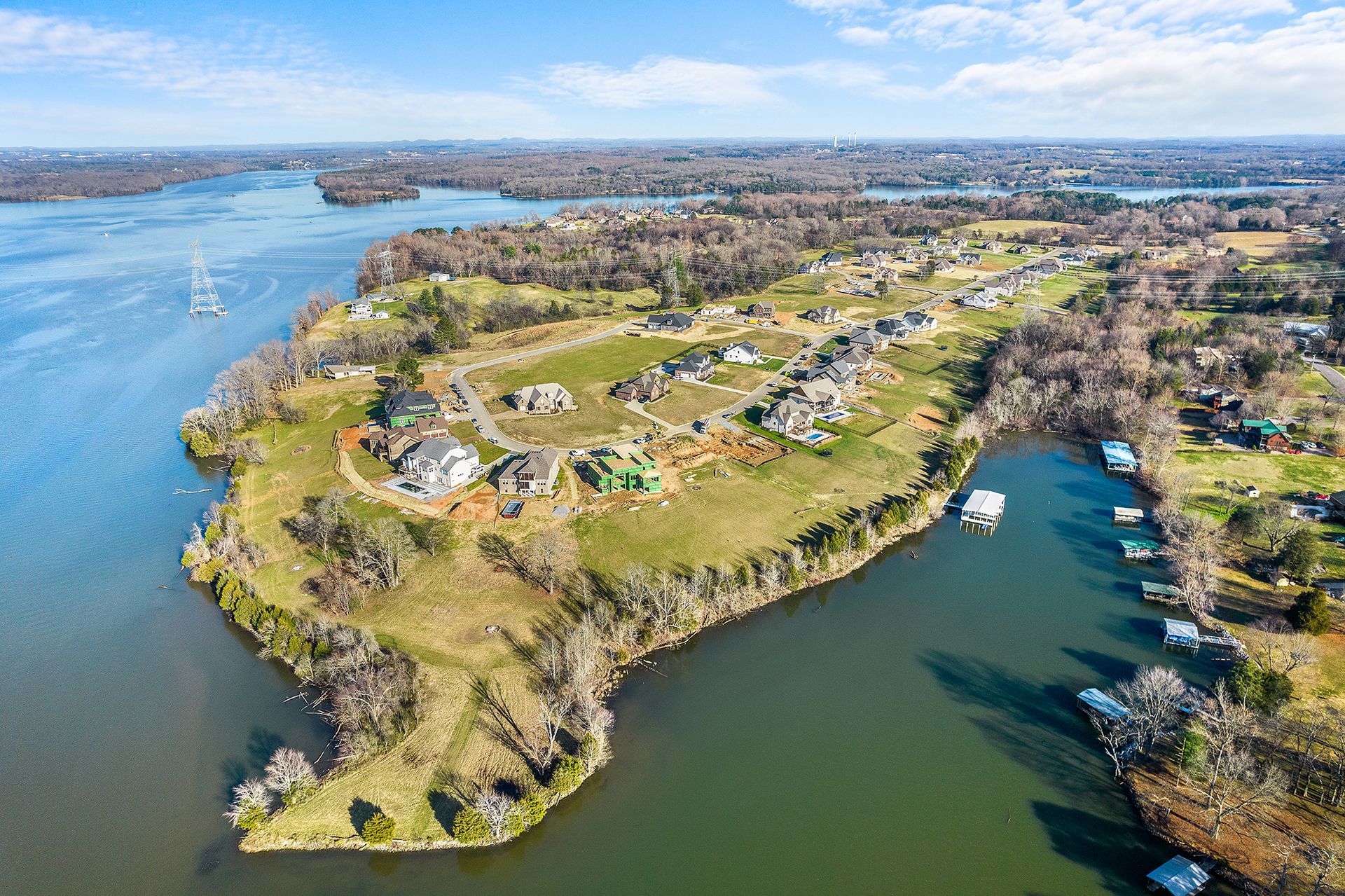 An aerial view of a lake with a small island in the middle.