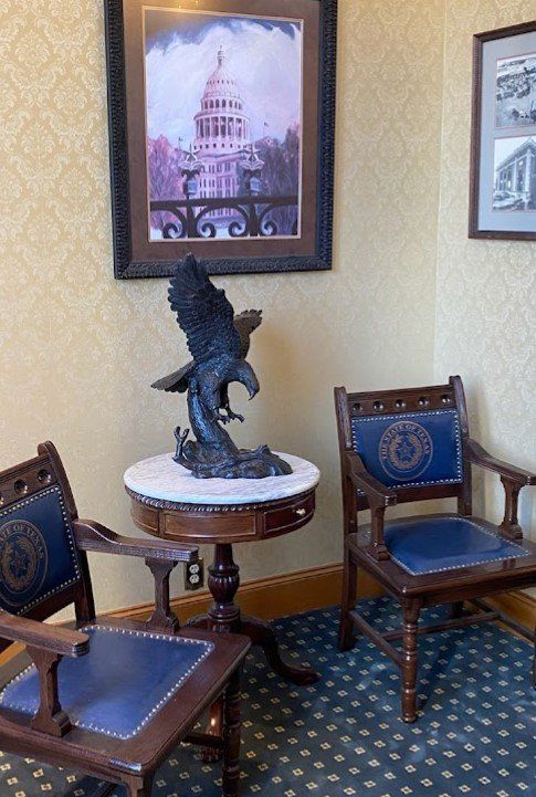 Chairs with an eagle statue